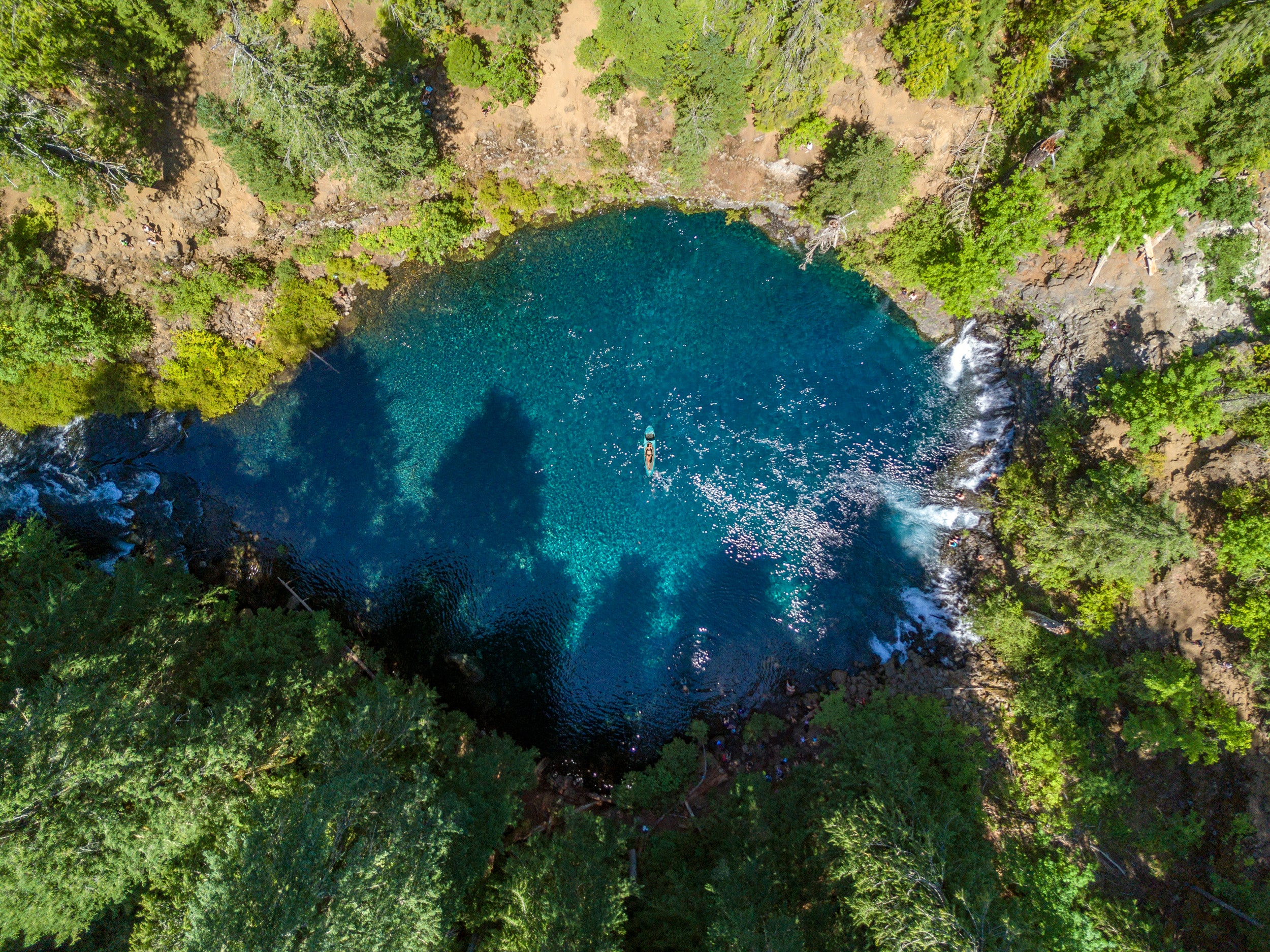 Floating on Good Vibes Superlite inflatable paddleboard by Stand on Liquid at Blue Pool Oregon