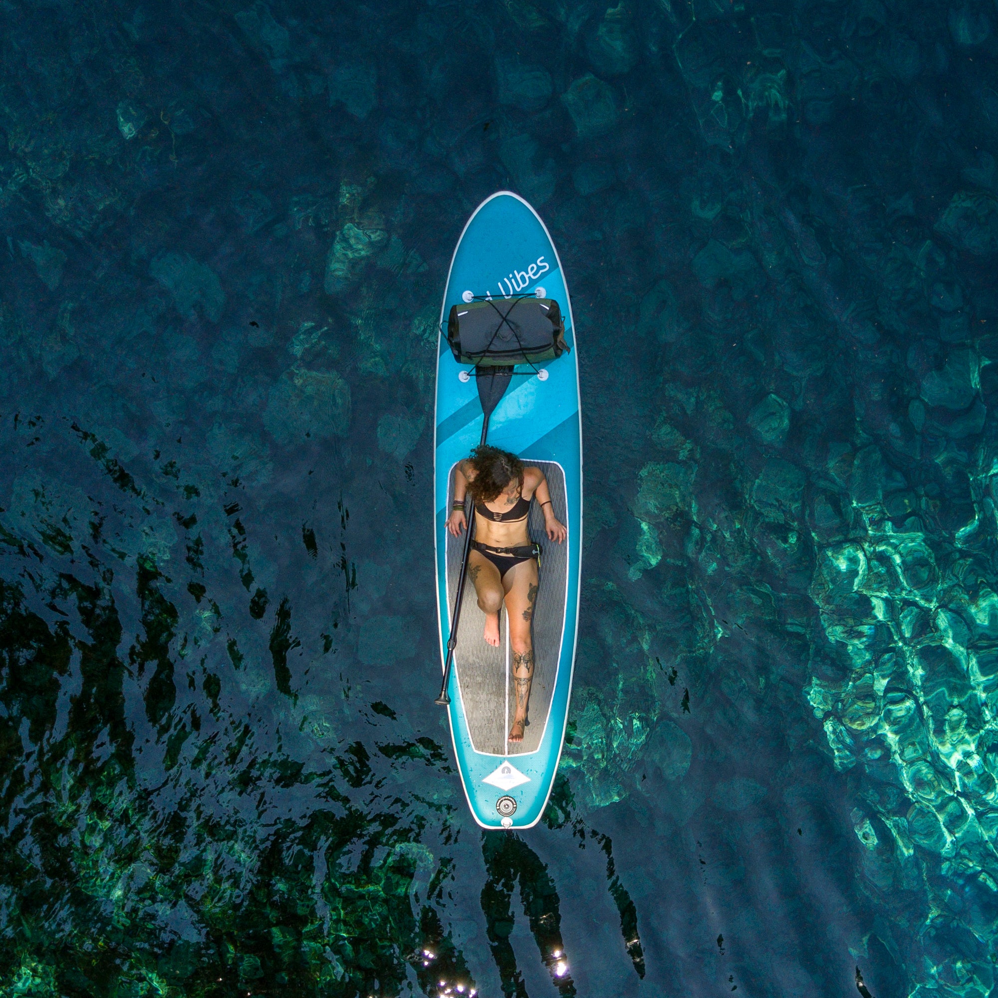 Floating on Good Vibes Superlite inflatable paddleboard by Stand on Liquid at Blue Pool Oregon