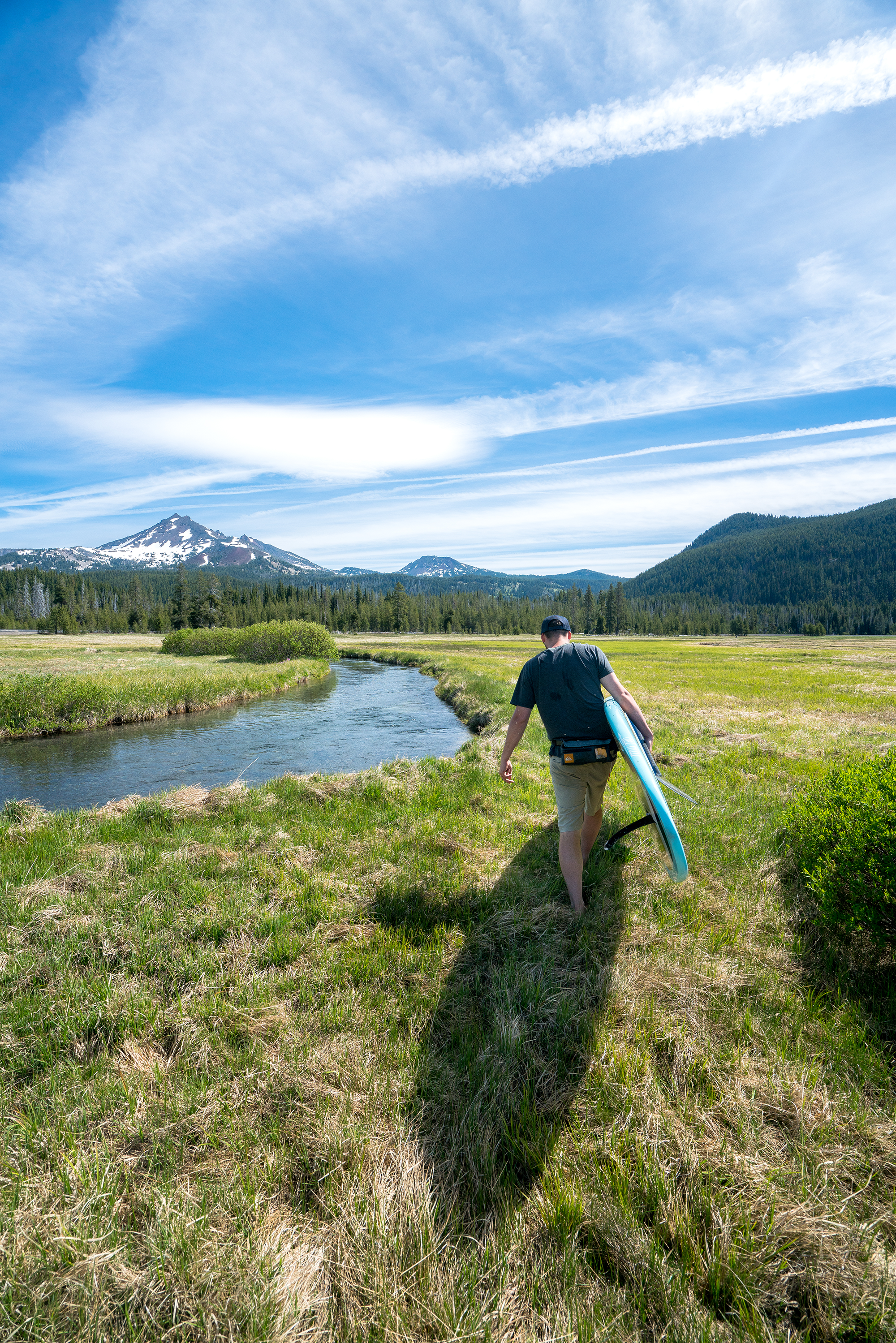 Walking with Big Wednesday Stand up paddle board by Stand on Liquid at Sparks Lake Oregon